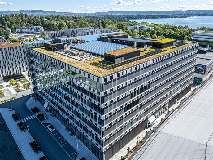 Aker Tech House with sedum roof and the Oslo Fjord in the background